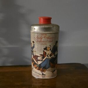 Avon Lady Skater Perfumed Talc Tin with Red Cap...... Half Full